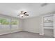 Bedroom featuring carpet, neutral walls, and a ceiling fan with windows providing ample light at 1873 Colding Dr, Ruskin, FL 33570