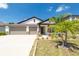 Charming single-Gathering home with a well-manicured lawn and attached two car garage at 1873 Colding Dr, Ruskin, FL 33570