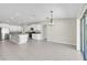 Open-concept kitchen with stainless steel appliances and sliding glass door to backyard at 1873 Colding Dr, Ruskin, FL 33570