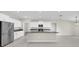 Modern kitchen featuring stainless steel appliances, white cabinets, and a granite island at 1873 Colding Dr, Ruskin, FL 33570