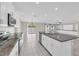 Spacious eat-in kitchen with granite countertops, stainless appliances, and backyard views at 1873 Colding Dr, Ruskin, FL 33570