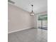 Living room featuring tile floors and sliding glass doors leading to the patio at 1873 Colding Dr, Ruskin, FL 33570