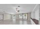 Bright living room boasts recessed lighting, sliding glass door, two windows, and built in cabinets at 1873 Colding Dr, Ruskin, FL 33570