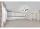 Bright living room boasts recessed lighting, tile floors, and built-in cabinets at 1873 Colding Dr, Ruskin, FL 33570