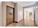 Well-lit hallway with a colorful welcome mat and a door adorned with a wreath, leading to a unit at 2411 W Horatio St # 526, Tampa, FL 33609