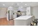 Bright kitchen featuring modern stainless steel appliances, white cabinets, and sleek countertops at 2411 W Horatio St # 526, Tampa, FL 33609