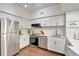Well-designed kitchen featuring stainless appliances, white cabinetry, and modern finishes for a sleek and clean look at 2411 W Horatio St # 526, Tampa, FL 33609
