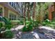 Lush landscaping with palm trees and various plants that enhance the property's appeal at 2411 W Horatio St # 526, Tampa, FL 33609