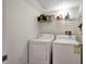 Laundry room featuring a white washer and dryer set with a shelf above at 2411 W Horatio St # 526, Tampa, FL 33609