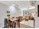 Cozy living room with a comfortable sofa, a dining area, and large windows offering natural light at 2411 W Horatio St # 526, Tampa, FL 33609