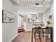 Open layout showcasing the dining area, kitchen, and easy access to a bedroom with barn doors at 2411 W Horatio St # 526, Tampa, FL 33609