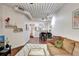 View of the well-lit living space with an open floor plan, including the dining area and modern kitchen at 2411 W Horatio St # 526, Tampa, FL 33609