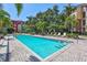 Beautiful outdoor pool area perfect for relaxation with lounge chairs and lush greenery at 2411 W Horatio St # 526, Tampa, FL 33609