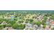 Aerial shot showcasing a residential neighborhood adjacent to a lush golf course and scenic lakes at 2505 Buckhorn Run Dr, Valrico, FL 33596