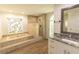 Bathroom featuring a soaking tub, separate shower, stained glass window, and single vanity with granite counters at 2505 Buckhorn Run Dr, Valrico, FL 33596