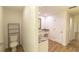 Bright bathroom with a toilet, vanity and sink that has marble countertops and wood look floors at 2505 Buckhorn Run Dr, Valrico, FL 33596