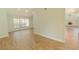 Open floor plan featuring wood-look flooring and a view to the brick fireplace at 2505 Buckhorn Run Dr, Valrico, FL 33596