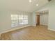 Bright, airy living room with vaulted ceiling and wood-look flooring at 2505 Buckhorn Run Dr, Valrico, FL 33596
