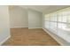 Bright living room featuring vaulted ceilings, wood-look flooring, and lots of natural light at 2505 Buckhorn Run Dr, Valrico, FL 33596