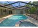 Screened-in pool and hot tub with an expansive deck, seamlessly connecting indoor and outdoor living at 2505 Buckhorn Run Dr, Valrico, FL 33596