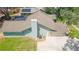 Aerial view of the home showcasing its architectural roof, and concrete driveway at 2505 Buckhorn Run Dr, Valrico, FL 33596