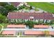 An aerial view of the condos and carports surrounded by trees and grass at 2593 Countryside Blvd # 7204, Clearwater, FL 33761