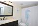 Well-maintained bathroom featuring a vanity with countertop, a toilet, and a shower/tub combo at 2593 Countryside Blvd # 7204, Clearwater, FL 33761