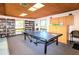 Community game room featuring a ping pong table and plenty of books at 2593 Countryside Blvd # 7204, Clearwater, FL 33761