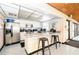 Well-equipped kitchen featuring stainless steel appliances, granite counters, and a breakfast bar at 2593 Countryside Blvd # 7204, Clearwater, FL 33761