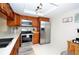 Well-equipped kitchen boasting stainless steel appliances and modern countertops at 2593 Countryside Blvd # 7204, Clearwater, FL 33761