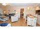 Open concept living and dining area with wood-look flooring and modern decor, perfect for relaxing and entertaining guests at 2593 Countryside Blvd # 7204, Clearwater, FL 33761