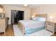 Tranquil main bedroom with a king-size bed, soft lighting, and balcony access, offering a peaceful retreat at 2593 Countryside Blvd # 7204, Clearwater, FL 33761