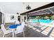 Inviting pool area with ample seating, shaded pergolas, and a refreshing atmosphere at 2593 Countryside Blvd # 7204, Clearwater, FL 33761