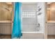 Bright bathroom with a tub and shower combination, plus dual vanities and updated fixtures at 2704 Chambray Ln, Tampa, FL 33611
