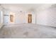 Expansive bedroom featuring soft carpeting, ceiling fan and multiple entry/exit points at 2704 Chambray Ln, Tampa, FL 33611
