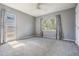 Comfortable bedroom with carpet, two windows, ceiling fan and curtains allowing natural light and privacy at 2704 Chambray Ln, Tampa, FL 33611