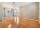 Dining room features hardwood floors, striped wallpaper, chandelier and large bay window at 2704 Chambray Ln, Tampa, FL 33611