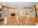 Spacious open-concept living area with hardwood floors, neutral paint, and ample natural light at 2704 Chambray Ln, Tampa, FL 33611