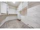 Well-organized walk-in closet with custom shelving and ample storage space for clothes and accessories at 2704 Chambray Ln, Tampa, FL 33611