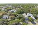 Aerial view of neighborhood homes with mature trees and lush landscaping at 2718 W Leila Ave, Tampa, FL 33611