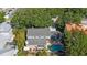 An aerial view of the home featuring a pool, large yard and mature landscaping at 2718 W Leila Ave, Tampa, FL 33611