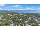 Aerial view showing a neighborhood near the bay with city skyline in the distance at 2718 W Leila Ave, Tampa, FL 33611