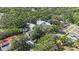 Aerial view of neighborhood homes with mature trees and lush landscaping at 2718 W Leila Ave, Tampa, FL 33611