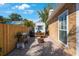 Brick patio with outdoor grill and wood-burning fire pit at 2718 W Leila Ave, Tampa, FL 33611