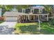 Charming two-story home with attached garage, manicured lawn, and mature landscaping at 2718 W Leila Ave, Tampa, FL 33611
