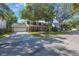 Lovely two-story brick home with a covered front porch, and a spacious driveway at 2718 W Leila Ave, Tampa, FL 33611