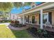Charming home with brick facade, covered front porch and front yard landscaping at 2718 W Leila Ave, Tampa, FL 33611