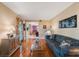 Comfortable living room with hardwood floors, blue sofa, stylish decor and neutral walls at 2718 W Leila Ave, Tampa, FL 33611