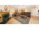 Comfortable living room showcasing a fireplace, wood-look flooring, and ample seating at 2718 W Leila Ave, Tampa, FL 33611