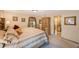 Warm and cozy main bedroom with a large bed, ensuite bathroom, and traditional décor at 2718 W Leila Ave, Tampa, FL 33611